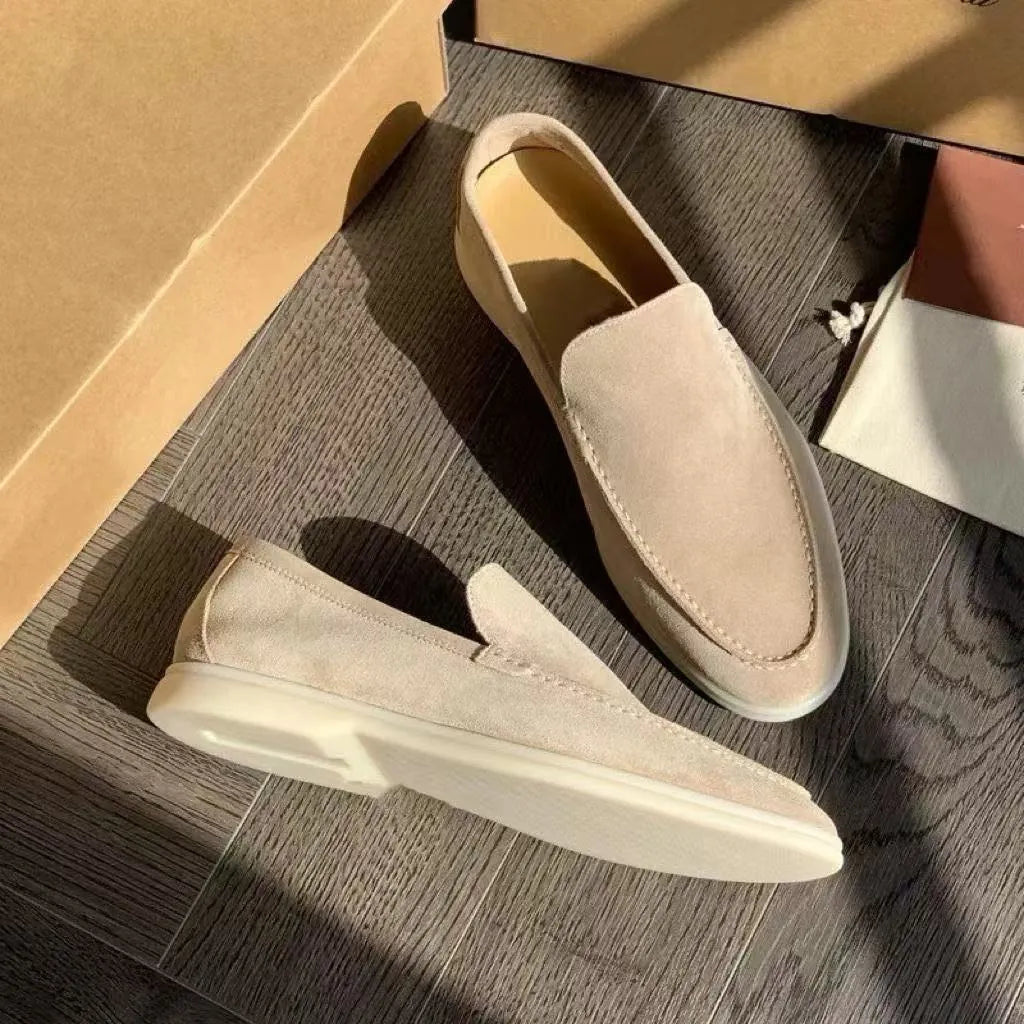 Light brown men's slip on loafers, paired indoor studio view