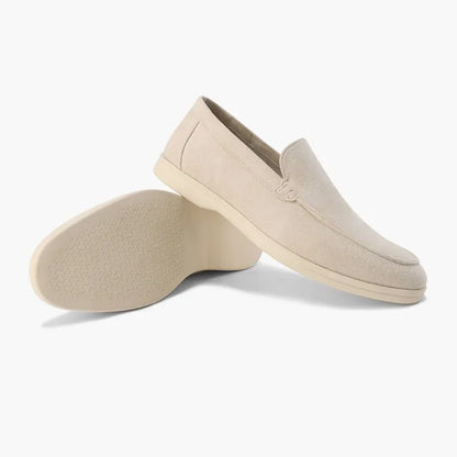 Light brown men's loafers shown from the side with outsole view