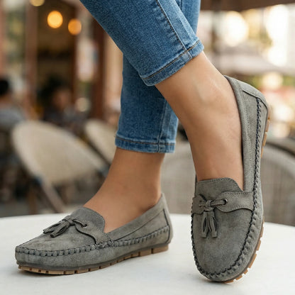 Charcoal grey loafers for women, close on foot street view