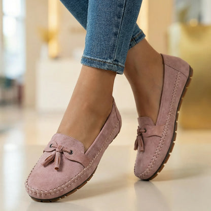 Blush pink loafers for women, close on foot indoor view
