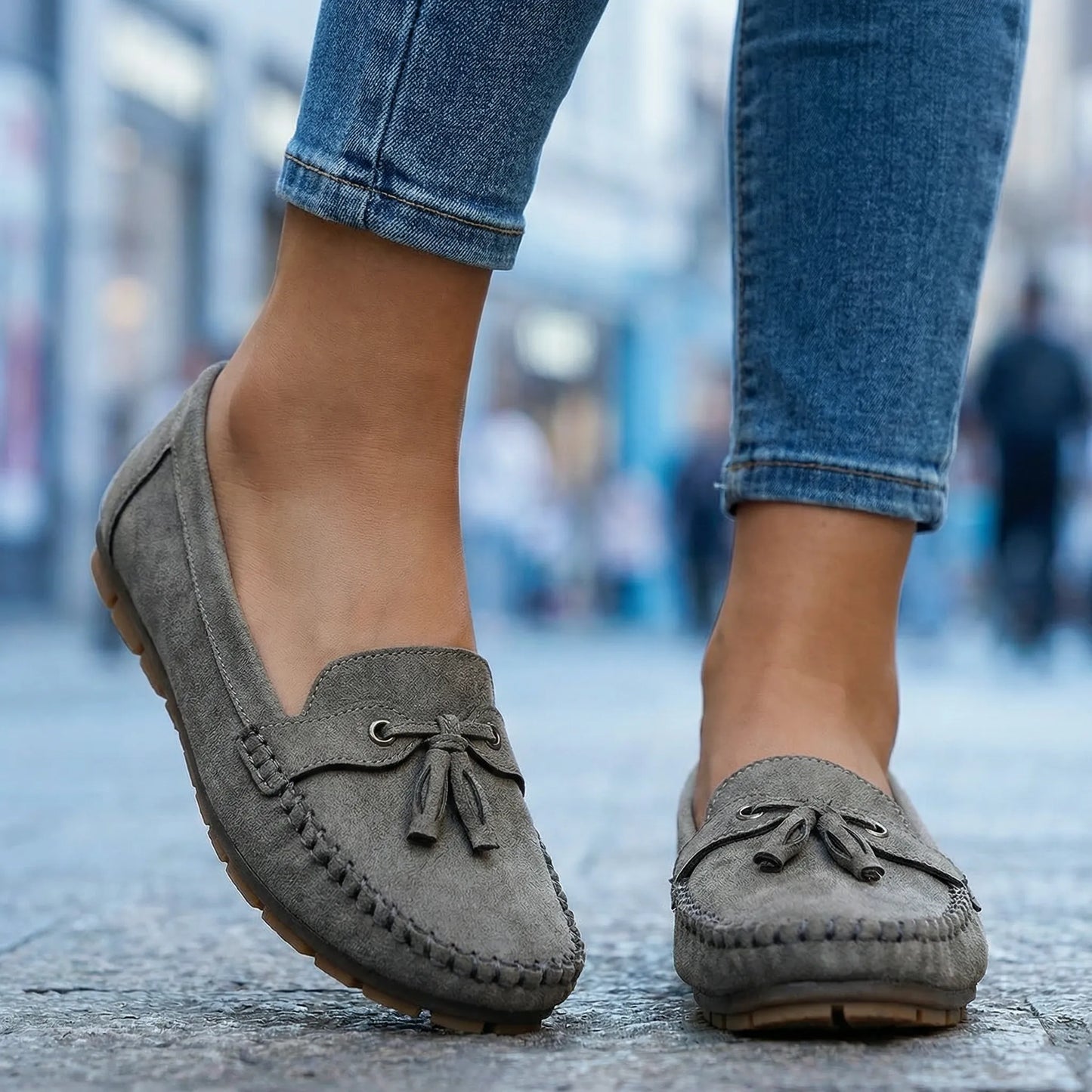 Charcoal grey wide fit loafers, on foot city pavement view