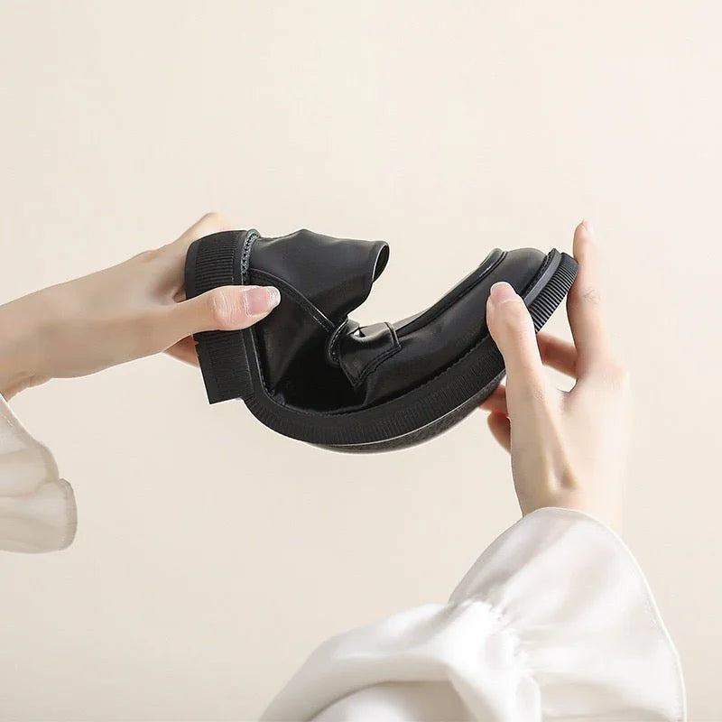 Women's chunky loafers shown flexing by hand