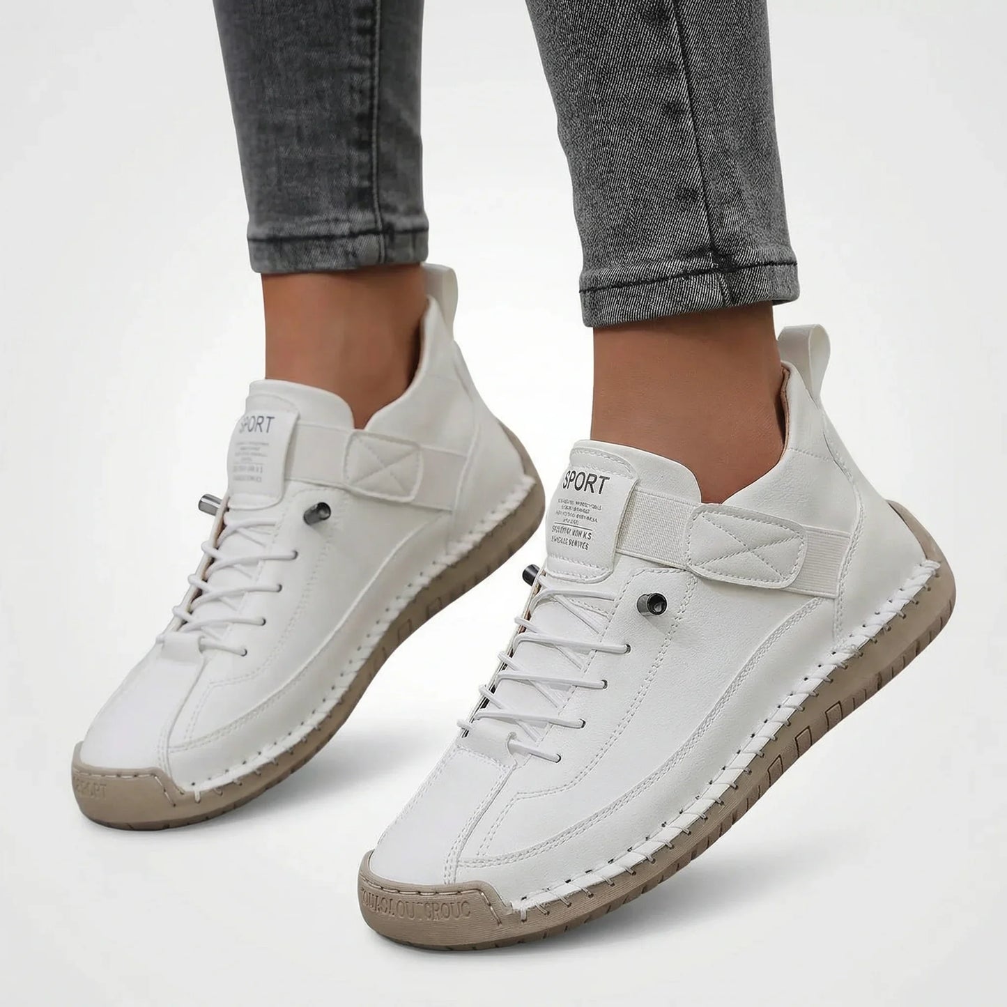 Women’s white wide fit walking trainers shown on foot for everyday wear