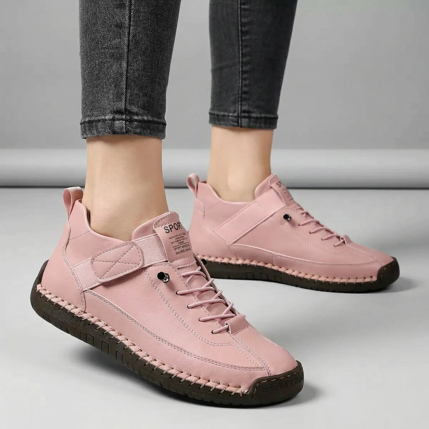 Women’s blush pink walking trainers with wide toe box shown on foot