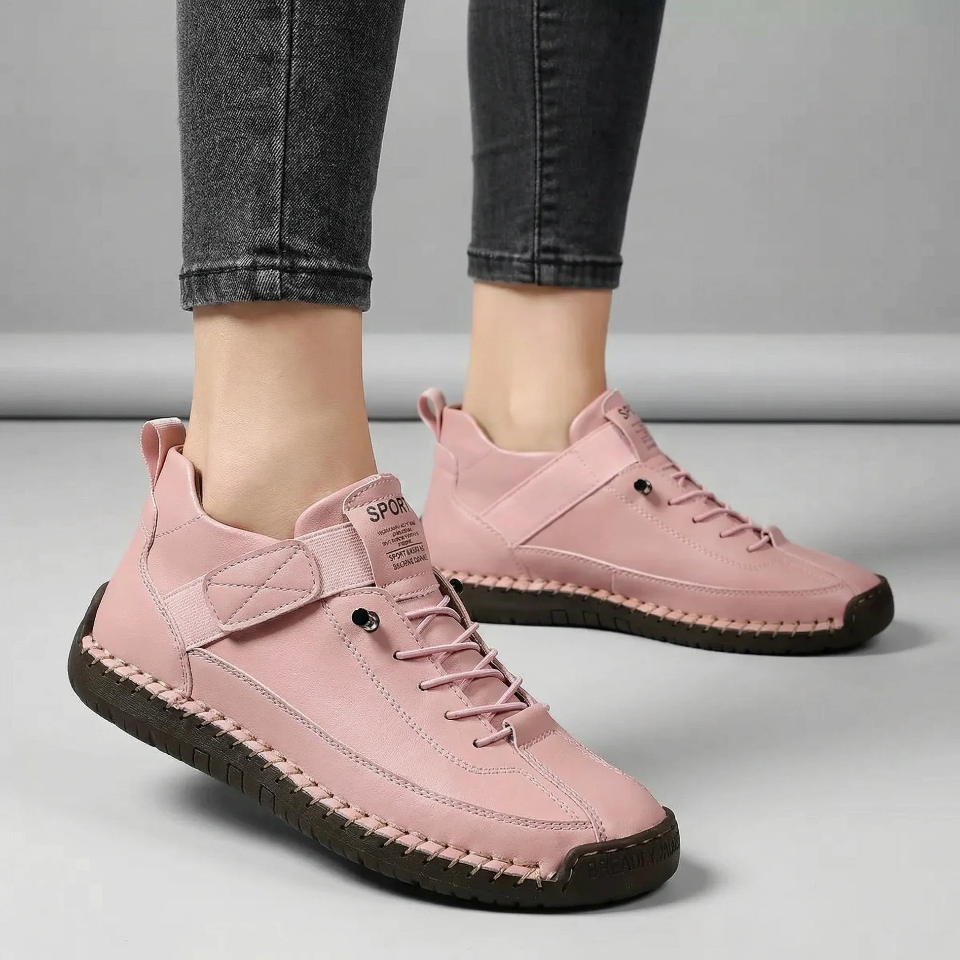 Women’s blush pink walking trainers with wide toe box shown on foot
