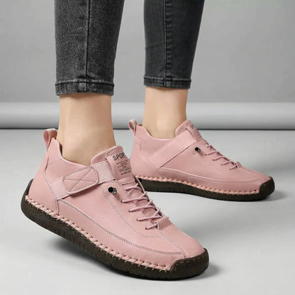 Women’s blush pink walking trainers with wide toe box shown on foot