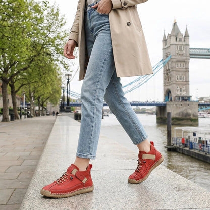 Woman wearing rust red wide fit trainers for a casual outdoor walk