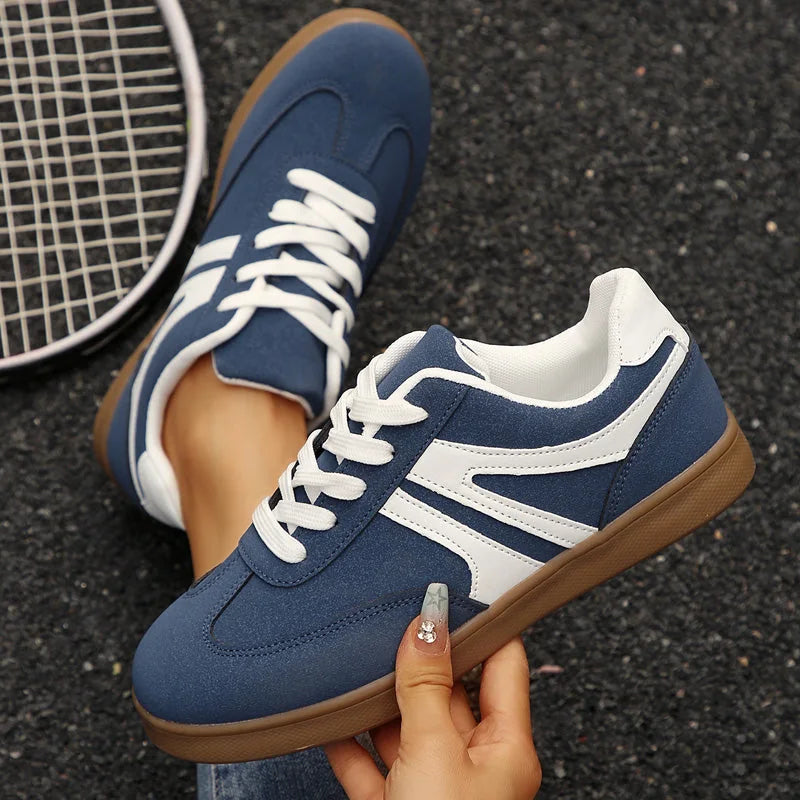 Navy retro trainers for women, top and side hand held views