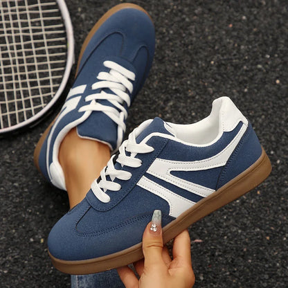 Navy retro trainers for women, top and side hand held views