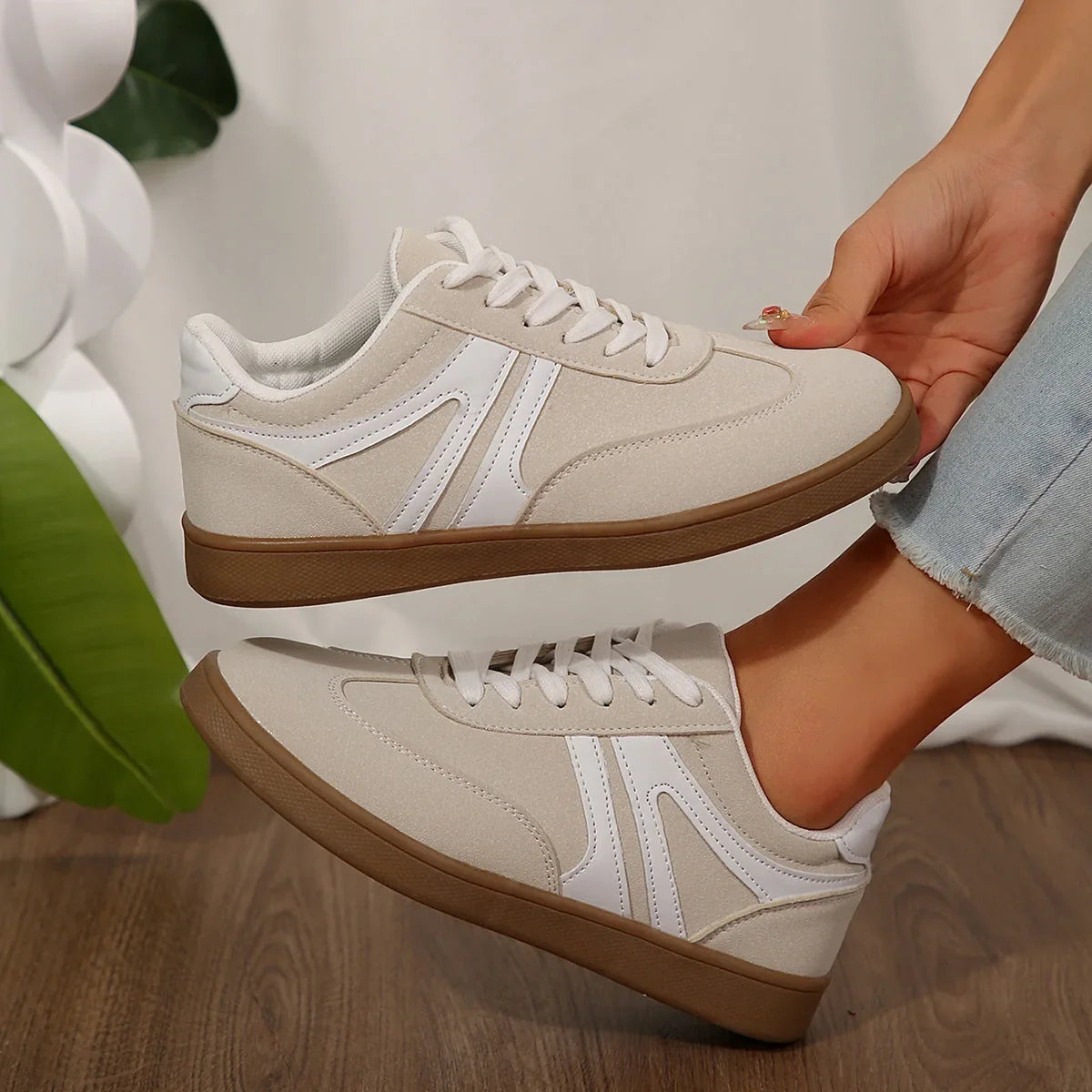 White walking trainers for women, close side on foot view