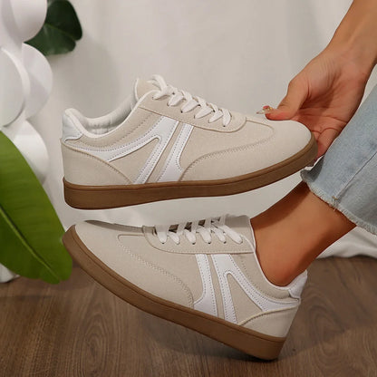 White walking trainers for women, close side on foot view