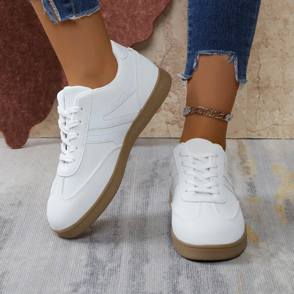 White retro trainers for women, close on foot view