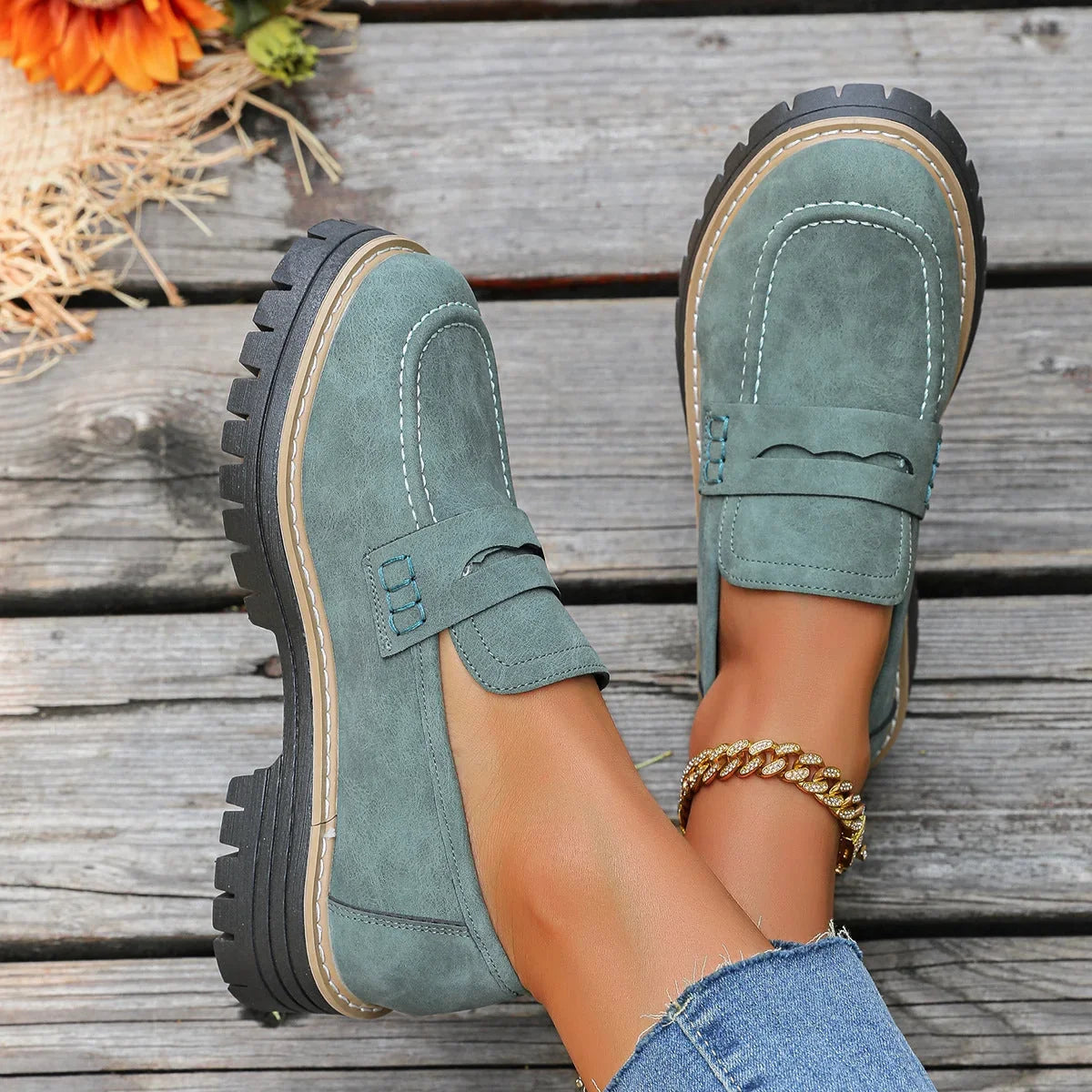 Dark green platform loafers, top on foot view