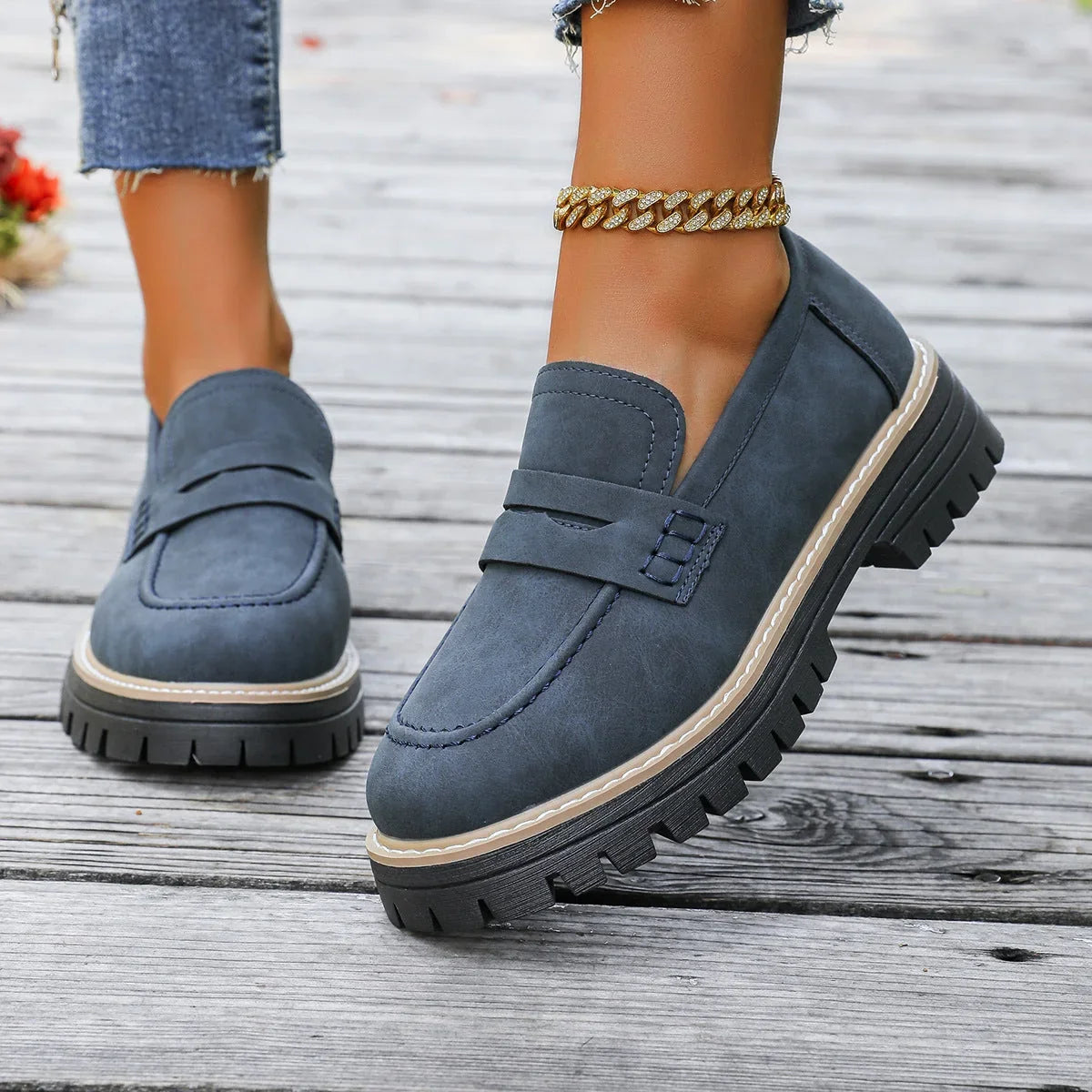 Blue chunky loafers for women, on foot side view