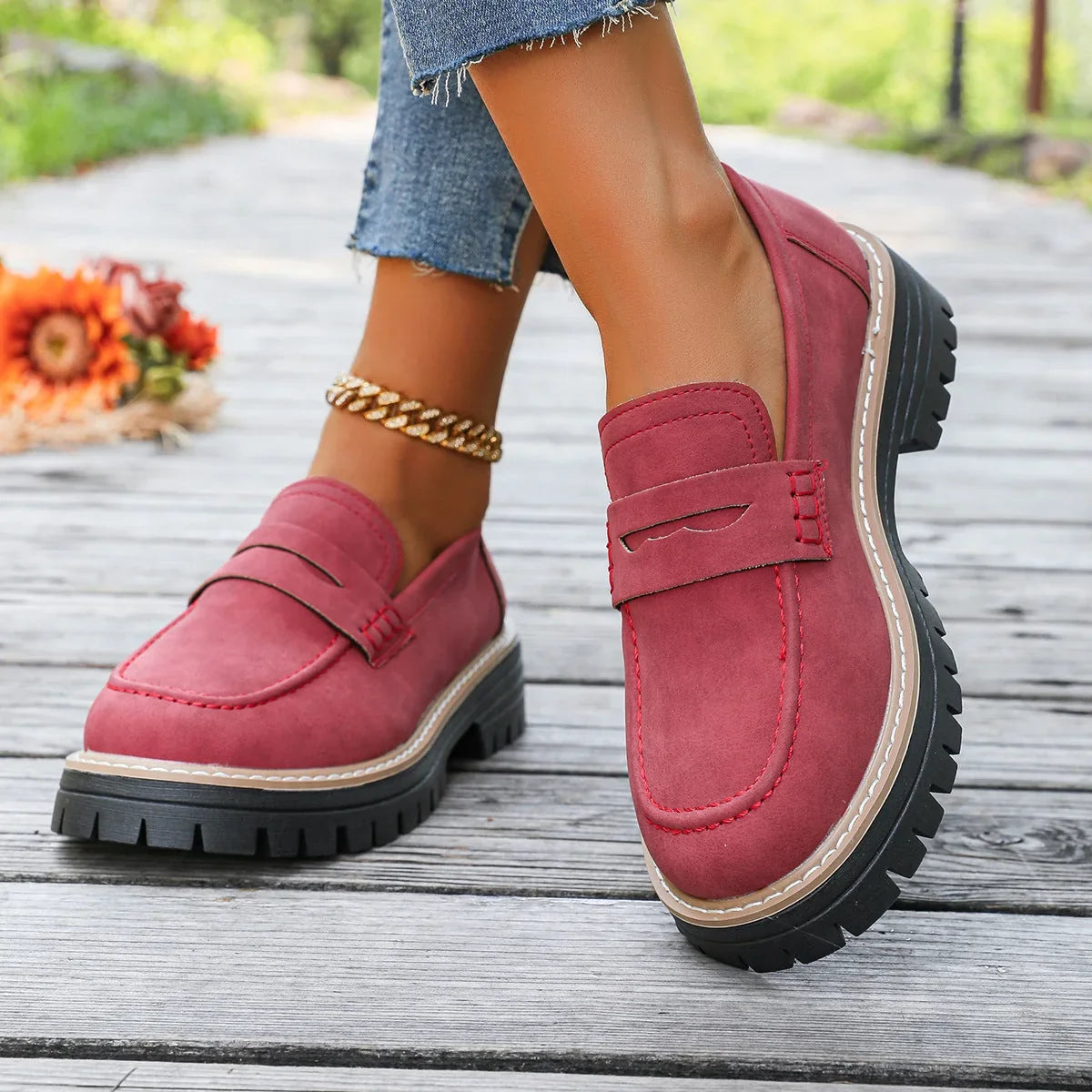 Red platform loafers for women, on foot side view
