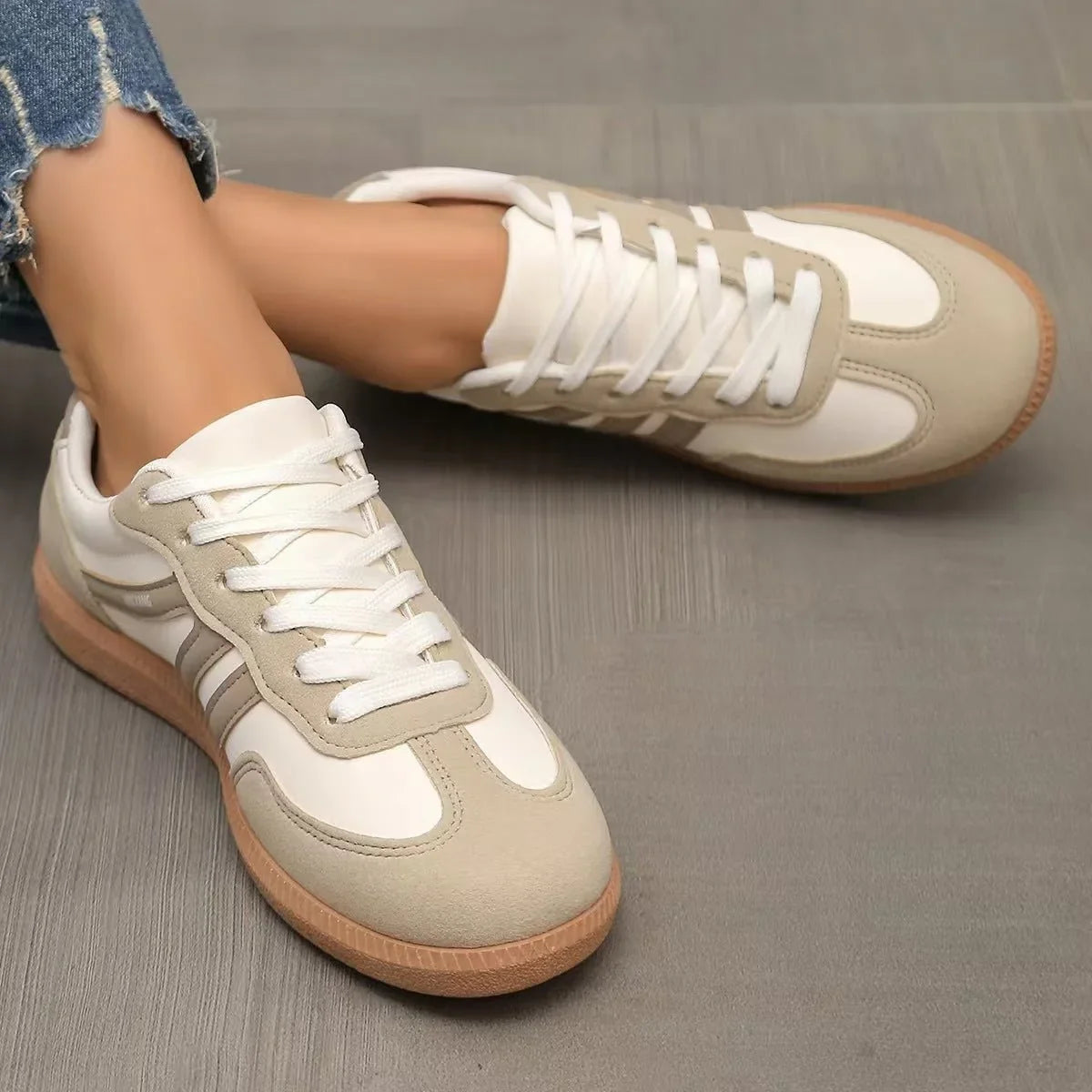 Women's beige and white retro trainers viewed from above