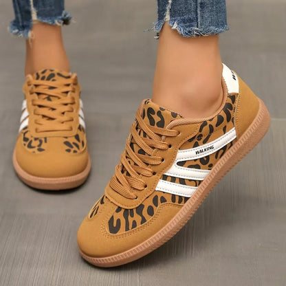Women's tan leopard print retro trainers worn from the front