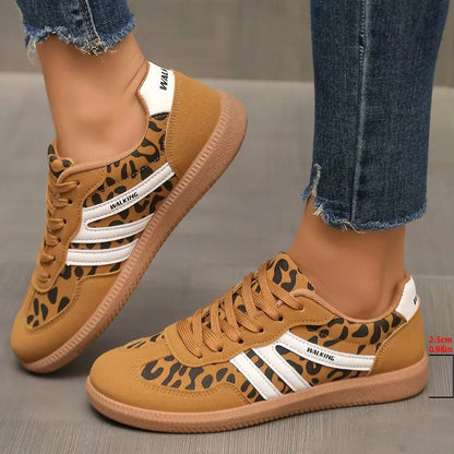 Women's tan leopard print retro trainers worn from the side