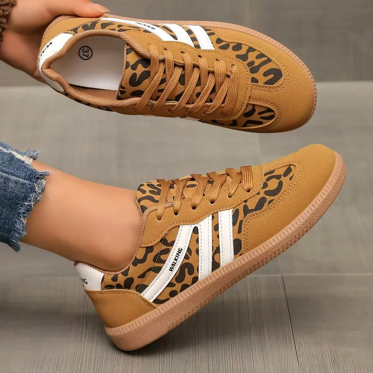 Women's tan leopard print retro trainers shown in side profile