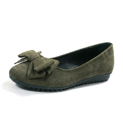 Dark green women’s bow ballet flat, isolated side view