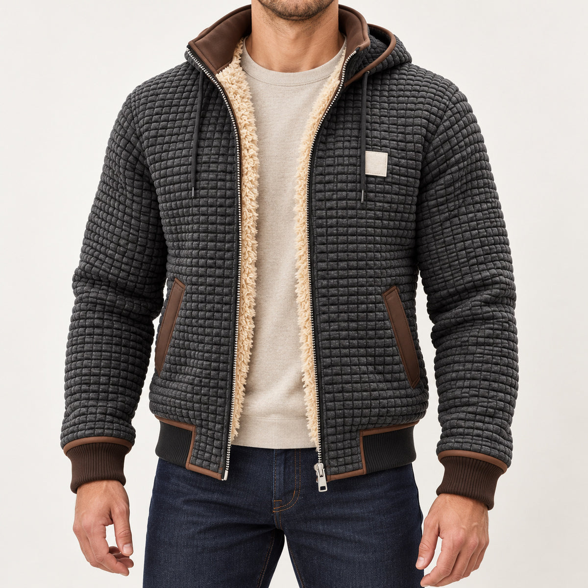 Charcoal Grey hooded fleece-lined jacket with brown trims, worn over an oatmeal jumper with the full jacket and both hands visible.