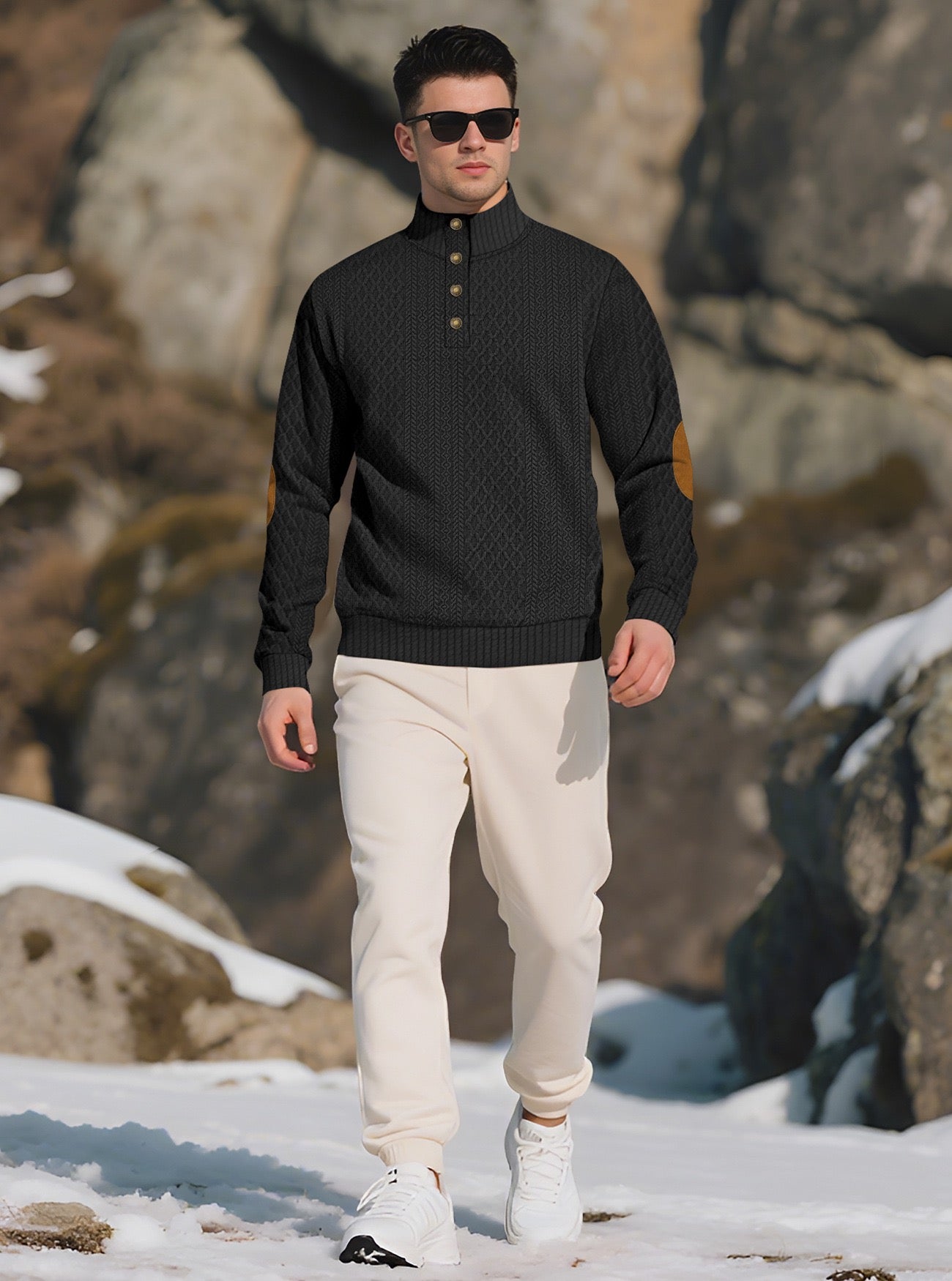 Model wearing the Black men's textured stand-collar pullover in a snowy mountain setting, front lifestyle view