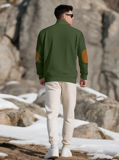 Model wearing the Forest Green men's textured stand-collar pullover in a snowy mountain setting, back lifestyle view