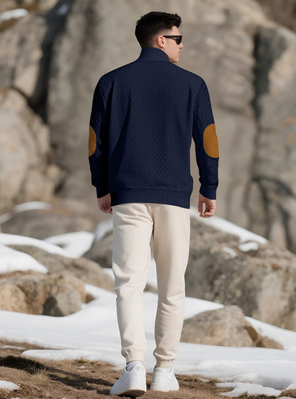Model wearing the Deep Navy men's textured stand-collar pullover in a snowy mountain setting, back lifestyle view
