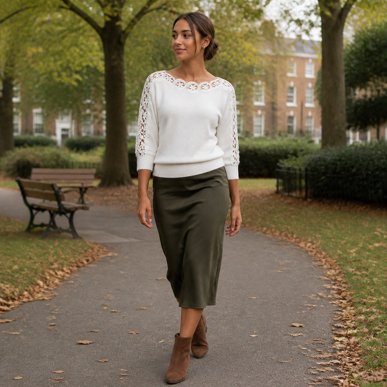 Woman wearing the Pearl White lace-panel knit top in a British autumn park