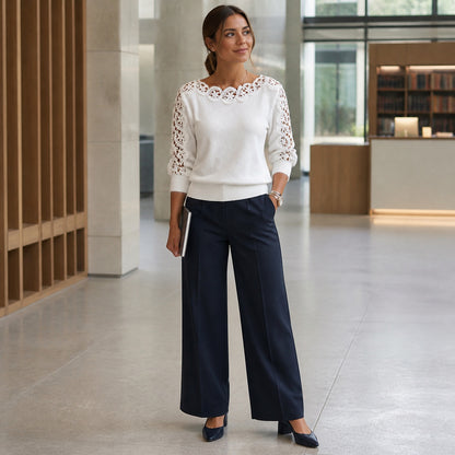 Woman styling the Pearl White lace-panel knit top for a British workday