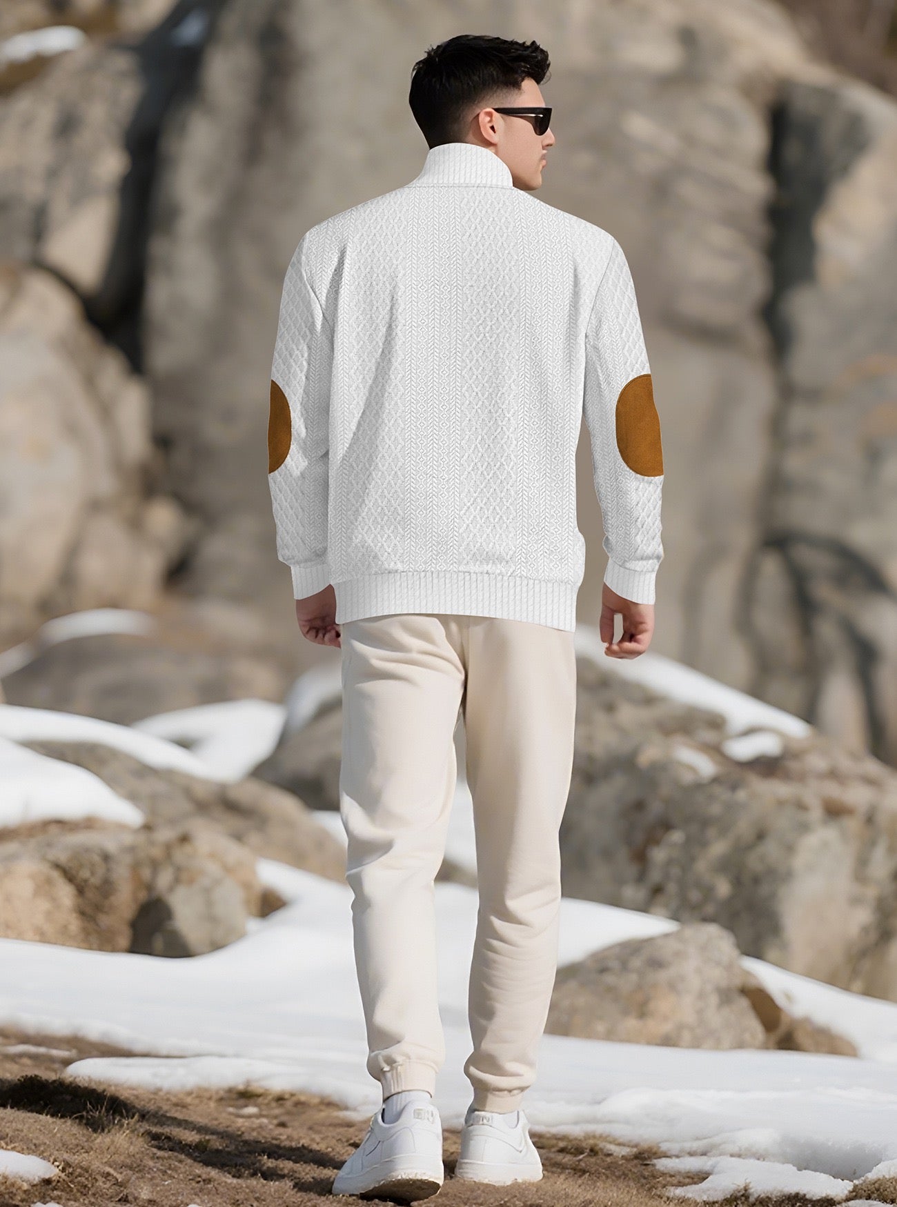 Model wearing the White men's textured stand-collar pullover in a snowy mountain setting, back lifestyle view